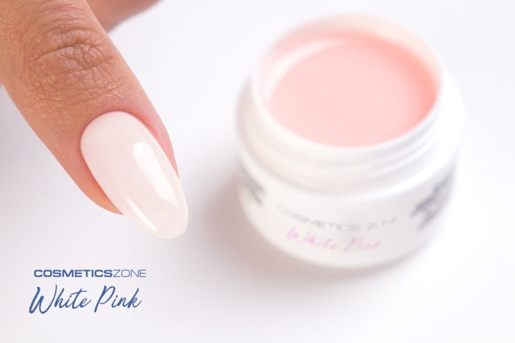 Paznokieć przedłużony mlecznoróżowym żelem Perfect Gel White Pink obok otwartego słoiczka